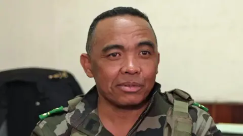 BBC A close-up of Col Michael Randrianirina in a military outfit