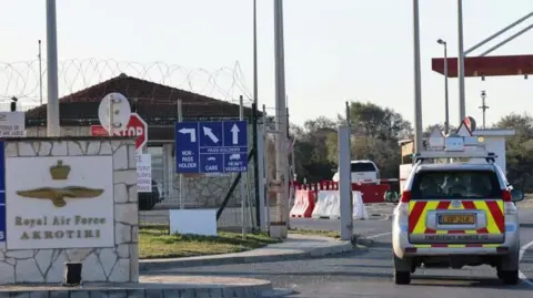 Getty Images Entrance to RAF Akrotiri with an emergency vehicle next to a sign with the base's name