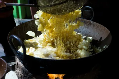 Getty Images Indian food being cooked on fire