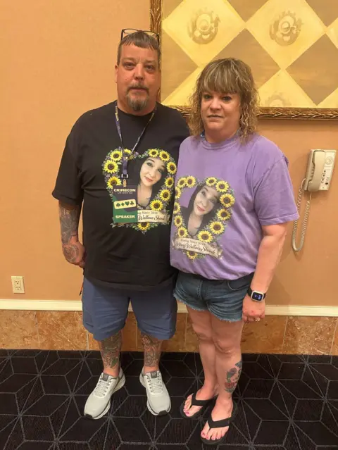 Greg Wallace and his wife wear T-shirts with their daughter's picture on it encircled in sunflowers