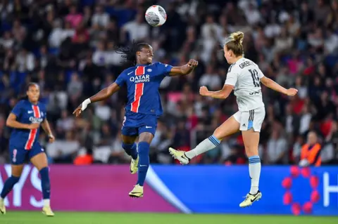 Franck Fife/AFP Tabitha Chawingar heads a ball for Paris St-Germain during a match against Paris FC - Monday 13 May 2024