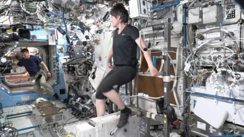 ESA/NASA ESA astronaut Samantha Cristoforetti using an exercise bike on the International Space Station.