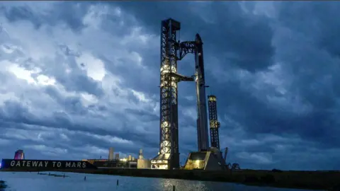Reuters Stormy weather, rolling in from the Gulf at sunrise, surrounds the SpaceX Starship spacecraft and the Super Heavy Booster as preparations continue for the 12th test flight of the Starship spacecraft in Starbase, Texas, U.S., May 21, 2026.