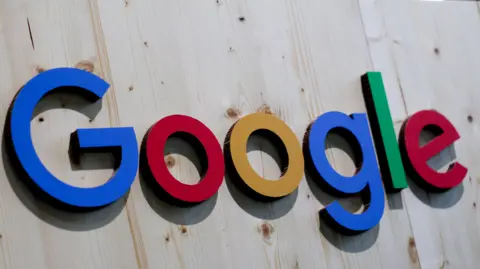 EPA Google's primary-colored logo on a large wooden sign.