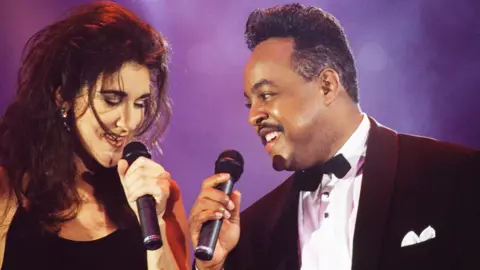 Getty Images Canadian singer Celine Dion and American R&B and soul singer and songwriter Peabo Bryson attend the 1992 Wolrd Music Awards ceremony in Monaco, May 14, 1992.