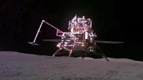 CNSA HANDOUT via EPA The Chinese lander-ascender mooncraft is pictured while being captured from the 'mobile camera' carried by the Chang'e-6 probe (out of frame), as it holds out a Chinese flag while stood on the surface of the moon against the dark abyss of space during China's moon mission on 4 June, 2024.
