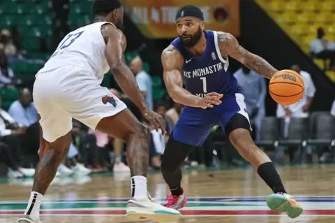 Cem Ozdel/Getty Images Basketball players from Rivers Hoopers and Tunisia's US Monastir participate in a game in Dakar, Senegal - Sunday 12 May 2024