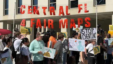 Getty Images People came from all over Florida to the State Capitol on Tuesday, April 28, 2026, to protest Gov. Ron DeSantis' new congressional map.