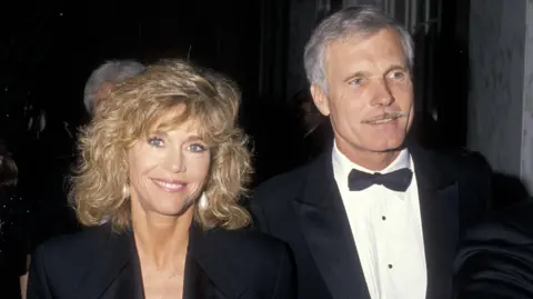 Getty Images Ted Turner with Jane Fonda in formalwear at the Volunteers of America's First Annual Glasnost Award Salute to Ted Turner on March 22, 1990 