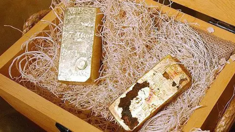 Getty Images large gold bars inside a wooden case