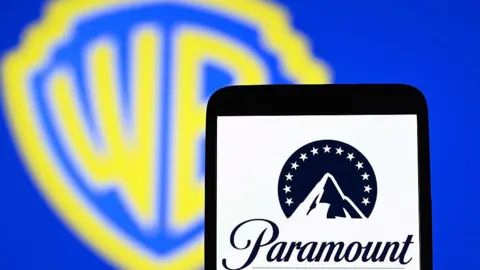 Getty Images a photo showing WB's logo and Paramount's logo 