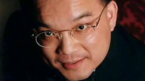 PA Media Close up image of Kenneth Law's face. He is looking at the camera and is wearing glasses.