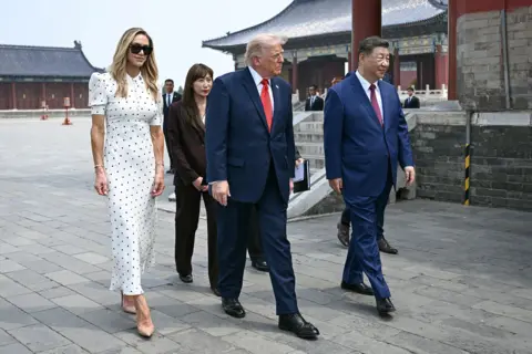 Reuters China's President Xi Jinping (R) and US President Donald Trump (C) visit the Temple of Heaven in Beijing on May 14, 2026.
