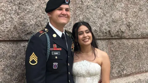 Courtesy of the family of Matthew Blank US Army Staff Sgt Matthew Blank wears his army uniform as he hugs his wife Annie Ramos in her white strapless wedding gown. 