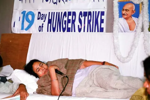 The The India Today Group via Getty Images Mamta Banerjee's fast, Trinamool Congress chief, 19 day of Hunger vstrike, protest fast against plans for a car factory in Singur. 
