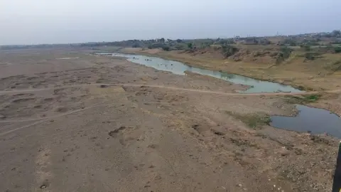 Ankit Srinivas A wide angle shot of the Ken river as it flows through the dusty lands of Banda