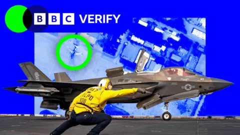 BBC A US navy airman gives an F-35 fighter a signal to take off. He is wearing a yellow jacket and a helmet and is pointing towards the runway. The jet is armed with missiles and is painted grey. The image is imposed over a satellite photo of an airbase in Iran where damaged jets are highlighted. 