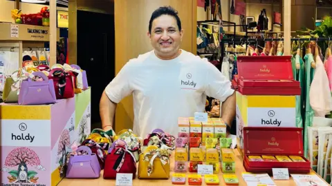 Push Sharma Push Sharma stands behind a display of his Haldy products.