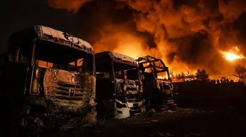 Anadolu via Getty Images Fire breaks out at the Shahran oil depot after US and Israeli attacks, leaving numerous fuel tankers and vehicles in the area unusable in Tehran, Iran on March 8, 2026.