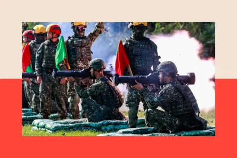 Anadolu via Getty Images Taiwanese soldiers training using shoulder-mounted RPGs
