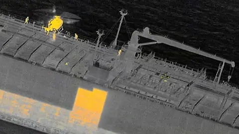 Swedish Coast Guard Infrared image of the Swedish coast guard boarding the Sea Owl One via helicopter in the Baltic Sea