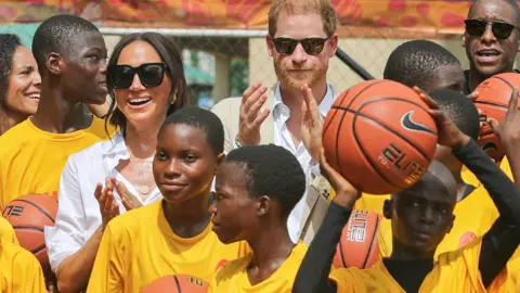 Akintunde Akinleye/Reuters The Duke and Duchess of Sussex at a basketball event in Lagos, Nigeria - Sunday 12 May 2024