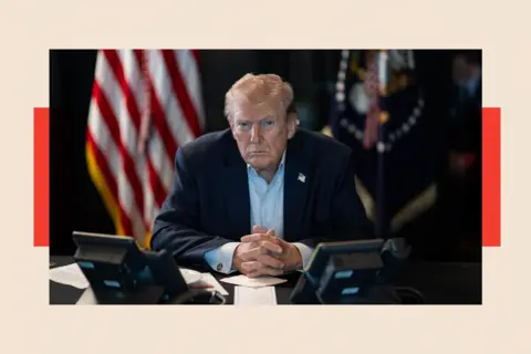 The White House via X Account/Anadolu via Getty Images US President Donald Trump sits at a table 