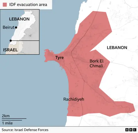 Map showing an area of southern Lebanon around the coastal city of Tyre shaded in red to indicate area the Israel Defense Forces are saying must be evacuated, extending inland to Bork El Chmali and south towards Rachidiyeh. An inset map locates the area within Lebanon, near the border with Israel.