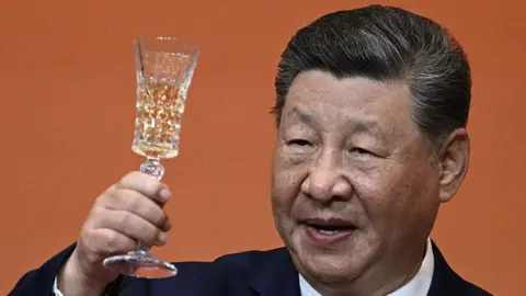Getty Images China's President Xi Jinping makes a toast during a state banquet for US President Donald Trump at the Great Hall of the People in Beijing on May 14, 2026.