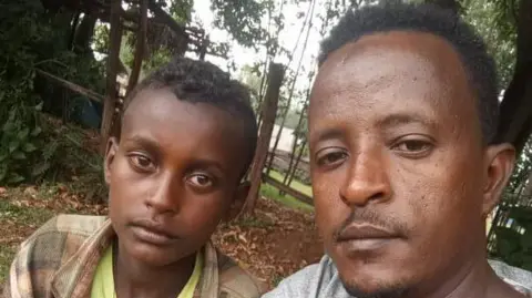 Umer Chane Markos Abaye and Umar Chane pose for a selfie