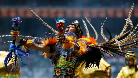 Reuters Performers during the opening ceremony before the match