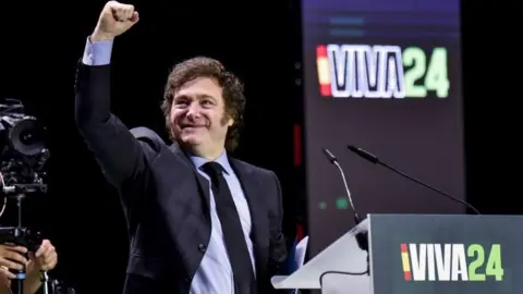 Getty Javier Milei, President of Argentina speaks the 'Europa Viva 24' and shakes his fist at the crowd