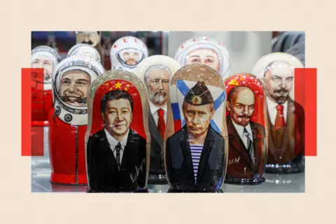 EPA-EFE/REX/Shutterstock Russian matryoshka dolls with portraits of the Chinese President Xi Jinping and Russian President Vladimir Putin sold on a street souvenir shop