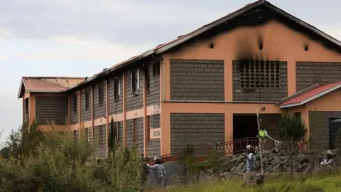 Shutterstock A two-storey dormitory building. Burn marks can be seen coming up on the external walls of the first floor.
