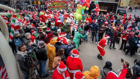 Getty Images People take the streets of New York City for SantaCon