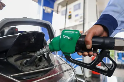 NurPhoto via Getty Images An employee fills the tank of a scooter with petrol at a Hindustan Petroleum fuel station in Srinagar, Jammu and Kashmir, on May 11, 2026. 