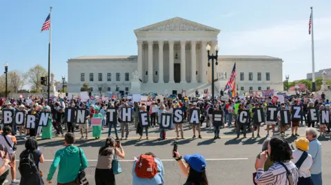 REUTERS/Kylie Cooper TPX IMAGES OF THE DAY Demonstrators hold letters making up the slogan 