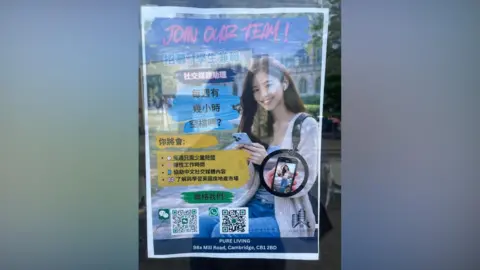 Robbie Kalus/BBC A poster in Mandarin, asking people to apply for a role. 