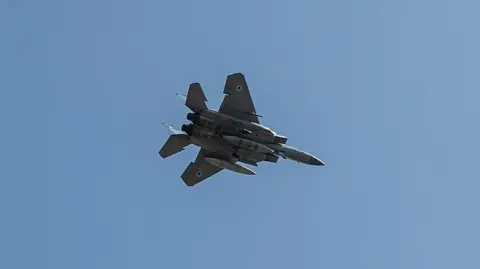 Getty Images An Israeli F-15 fighter jet seen from below - two crew members from a similar plane were rescued from inside Iran over the weekend 