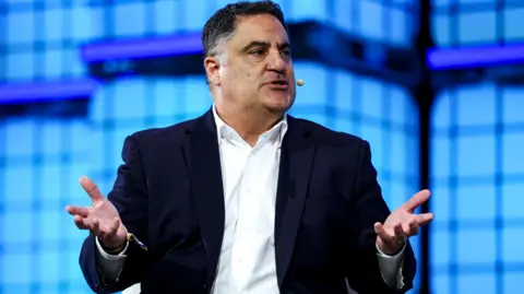 Getty Images The host of "The Young Turks" commentary show Cenk Uygur speaking with his hands stretched open