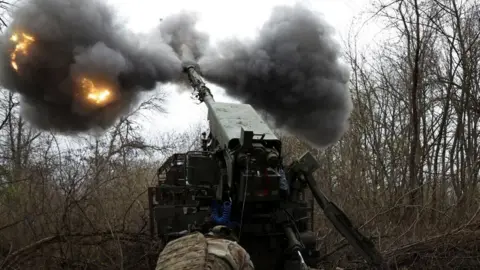 Reuters A Ukrainian gunner fires a self-propelled howitzer on Russian positions in Ukraine's eastern Donetsk region. File photo