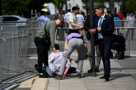 Reuters A man was immediately detained after the shooting