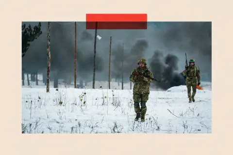 Global Images Ukraine via Getty Images Ukrainian servicemen with firearms 