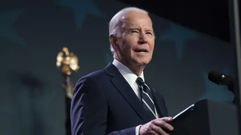 Bloomberg via Getty Images Former US President Joe Biden pictured speaking at a conference in Washington DC 