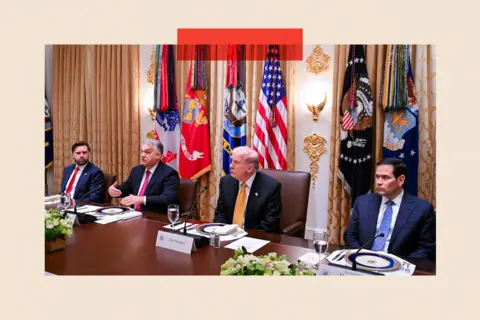 Getty Images The table is set for a formal dinner in the White House, with JD Vance, Orban, Trump and Marco Rubio sitting down. They all wear suits. 