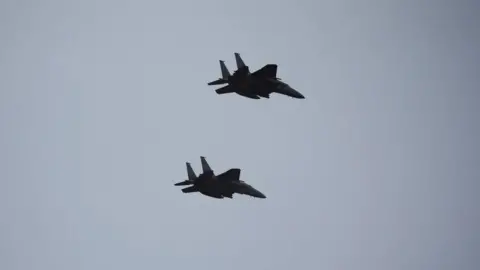 Getty Images Two of South Korean Air Force's F-15K fighter jets flying during a celebration to mark 76th anniversary of Korea Armed Forces Day in Seongnam in 2024