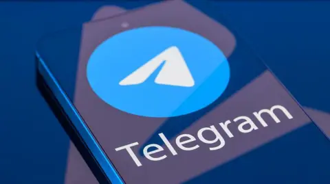 Getty Images Telegram logo displayed on a smartphone screen.