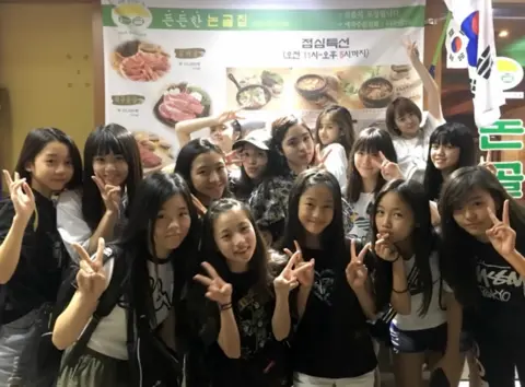XGALX A photo showing the young trainees for the pop group XG, seven of whom would make the final line-up of the band