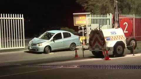 Reuters A police cordon around the car involved 
