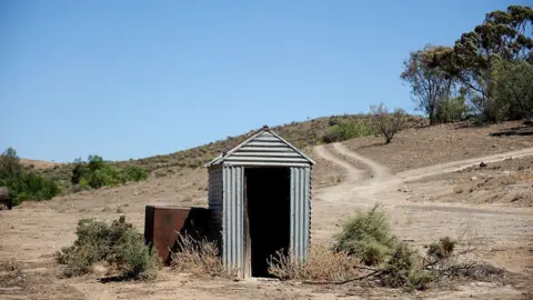 Getty Images A file photo of a pit latrine, or long-drop toilet, in rural Australia